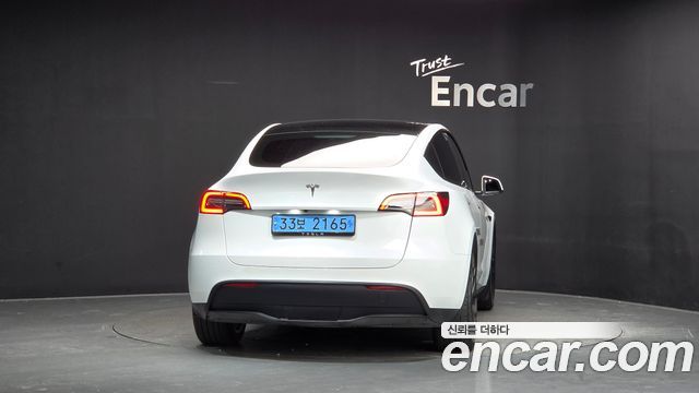 Tesla Model Y RWD — пробег 23 587 км — фото 4 из 5